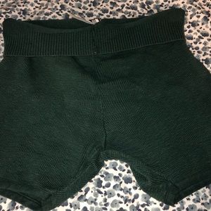 Knit green shorts.